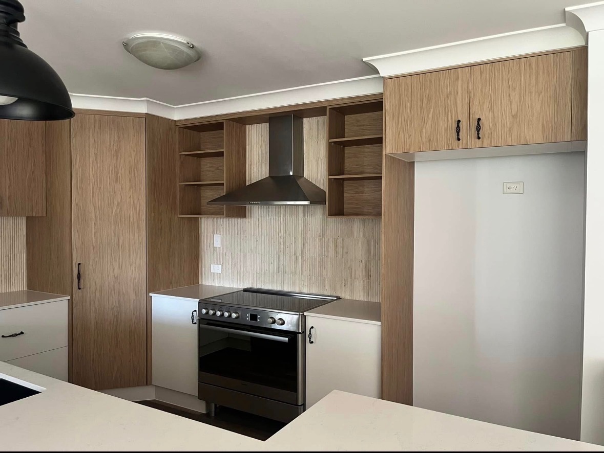 Custom light-wood kitchen with stone benchtop — PMG Cabinetry